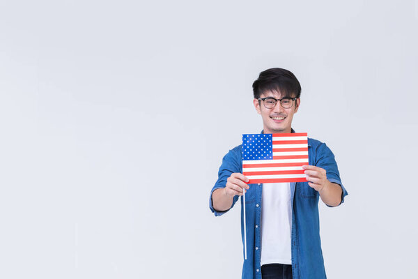 Asain man holding American flag.