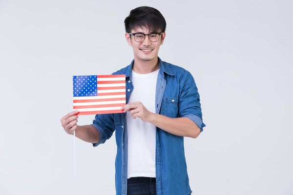 Asain man holding American flag.