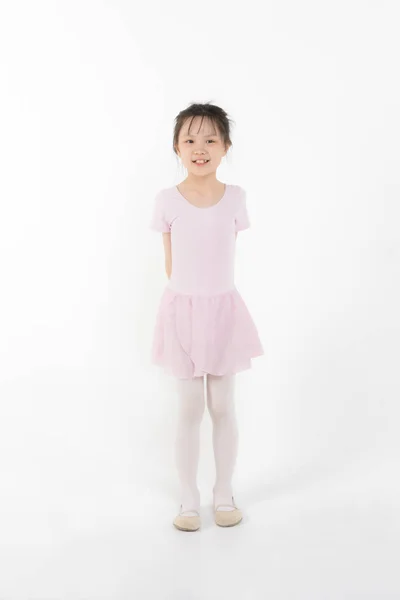 Pink dressed Asian girl in a ballet pose — Stock Photo, Image