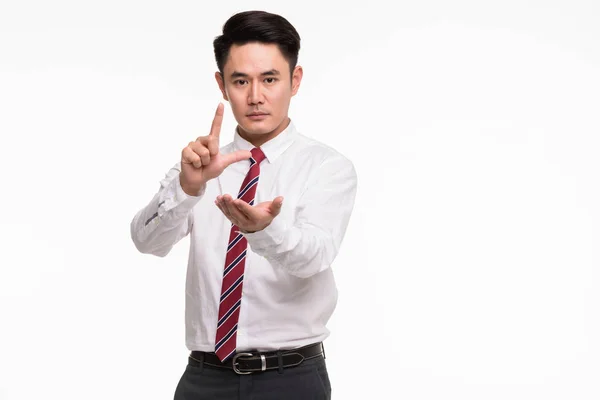 Asiatiska affärsman stående och peka fingret — Stockfoto