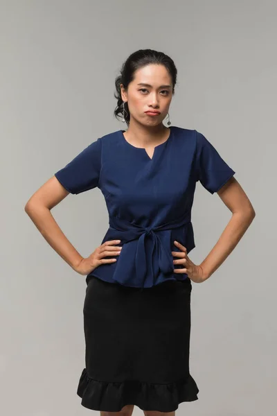 Asian businesswoman standing and akimbo