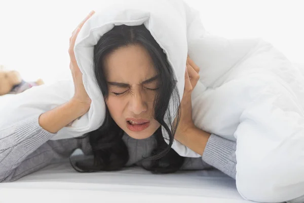 Woman lie prone and put blanket cover head — Stock Photo, Image