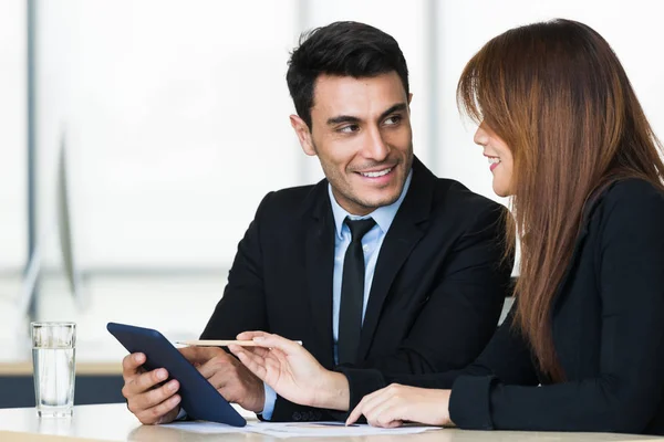 Business people use tablet computer