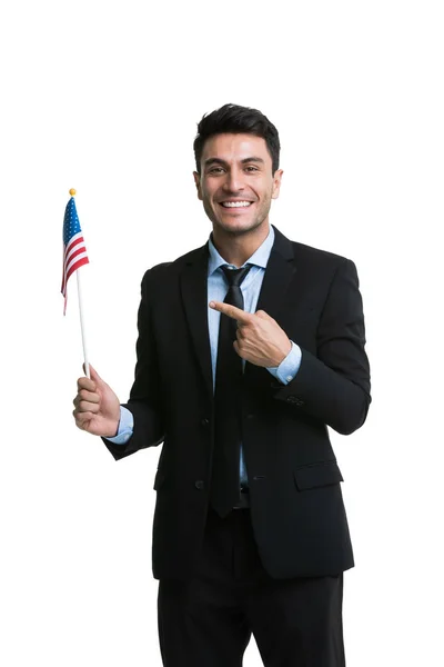 Caucasian businessman lifting America flag — Stock Photo, Image