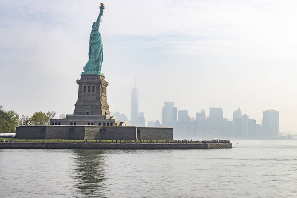 The statue of liberty with Manhattan in the background, New York, United States
