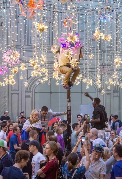 2018 FIFA World Cup Russia. Football fans of different countries celebrate the victory of the Russian team over Spain at Nicholas Street in Moscow/
