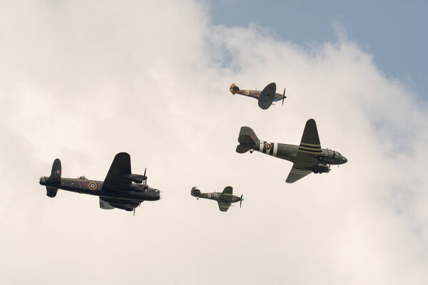 TELFORD, UK, JUNE 10, 2018 - A photograph documenting the Battle of Britain Memorial Flight performing their Trenchard formation display to celebrate the centenary of the RAF