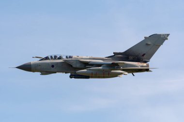 TELFORD, UK, JUNE 10, 2018 - A photograph documenting a solo Panavia Tornado GR4 aircraft displaying for the RAF 100 Centenary air show celebration clipart