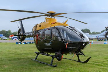 COSFORD, UK, JUNE 6 2018: An Airbus Helicopters H135M Juno HT.1 stands awiaitng a sortie whilst on active serivice at RAF Cosford clipart