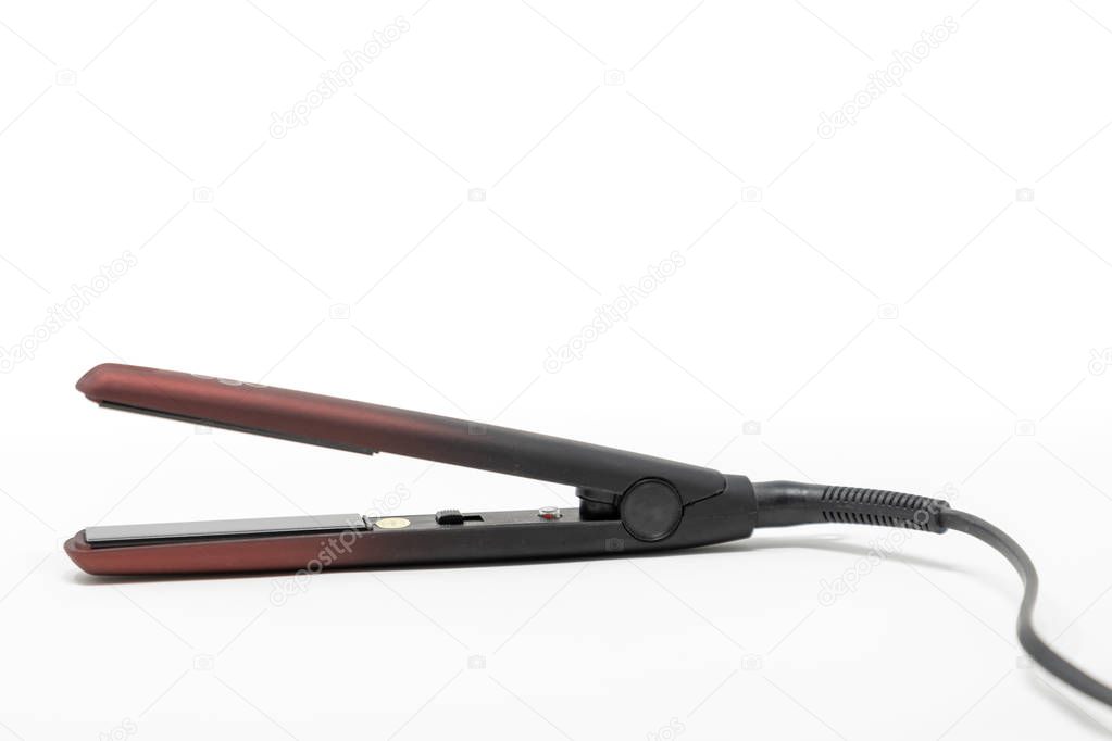 A debadged pair of hair straighteners set against a white background