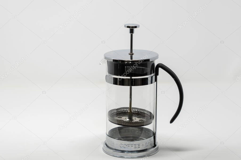 An empty cafetiere set with a white background