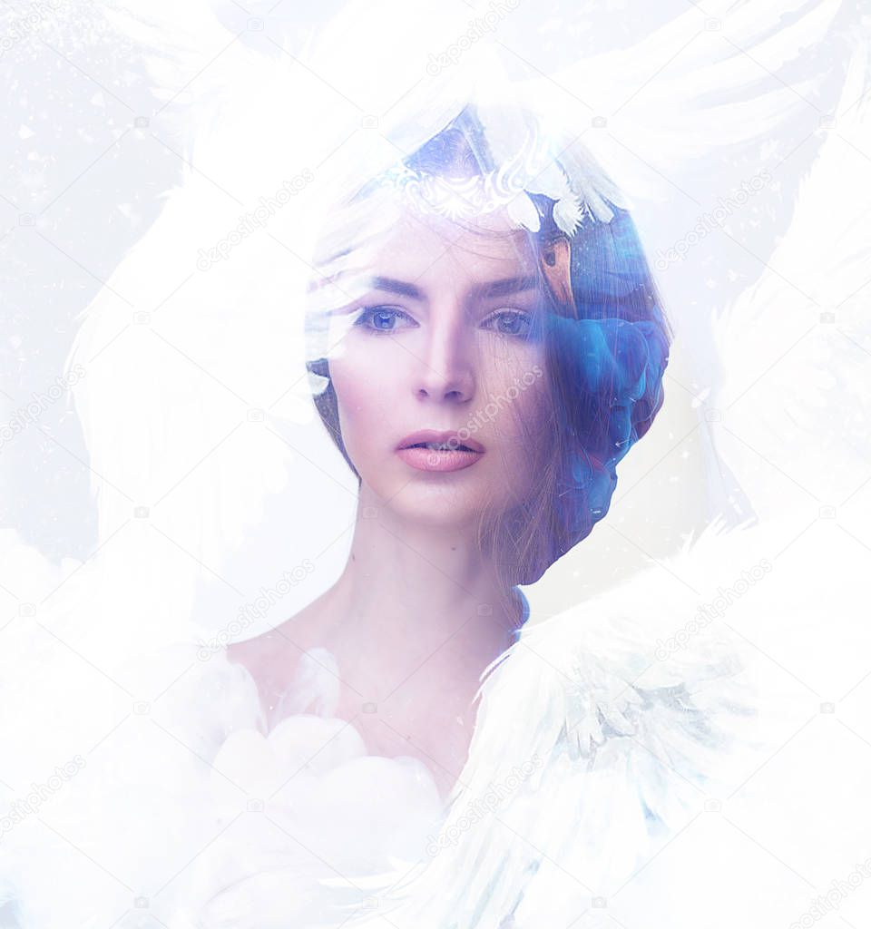 White swan conceptual portrait. Beautiful young woman in white feathers and snow in blue light with soft makeup, pure skin and romantic hairstyle. Visual digital art