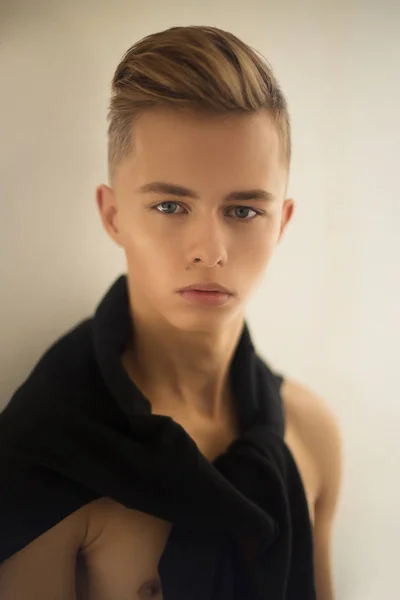 Young Man Blonde Hair Wearing Black Sweater His Shoulders Posing — Stock Photo, Image