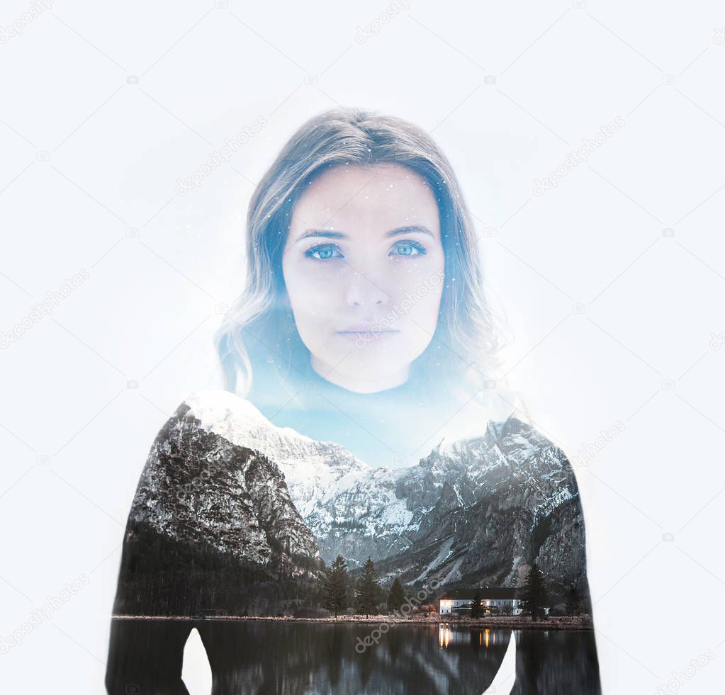 Double exposure portrait of a young thoughtful woman combined with photograph of mountain landscape. Conceptual image showing unity of human with nature. Ecology, freedom, environment. Isolated on white background