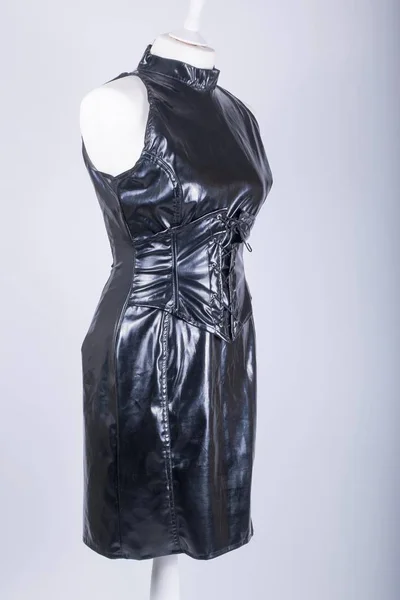 A Tailors Mannequin dressed in a Black PVC Dress