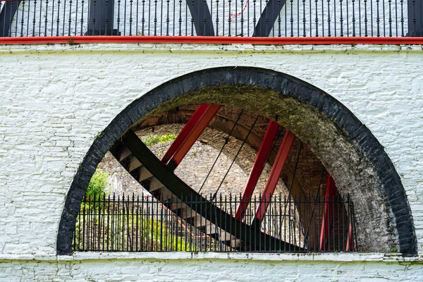 The Laxey Wheel also known as Lady Isabella is built into the hillside above the village of Laxey in the Isle of Man. It is the largest working waterwheel in the world — Stock Photo, Image