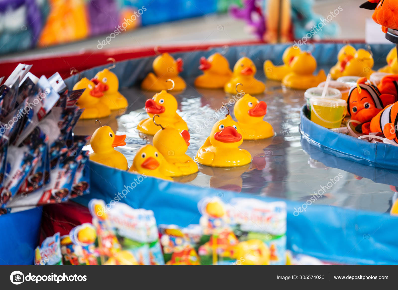Rubber yellow ducks with hooks in their heads. Fairground hook a rubber