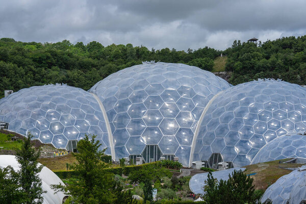 The Eden Project is a visitor attraction in Cornwall, England, UK. Inside the two biomes are plants that are collected from many diverse climates and environments