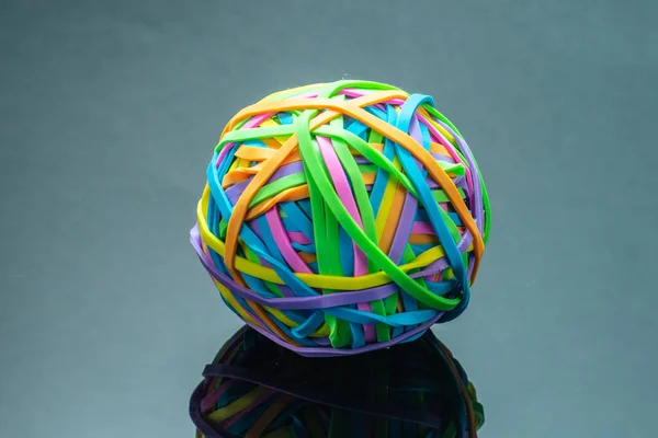Rubber Band Ball.Colorful rubber band Paper Bills