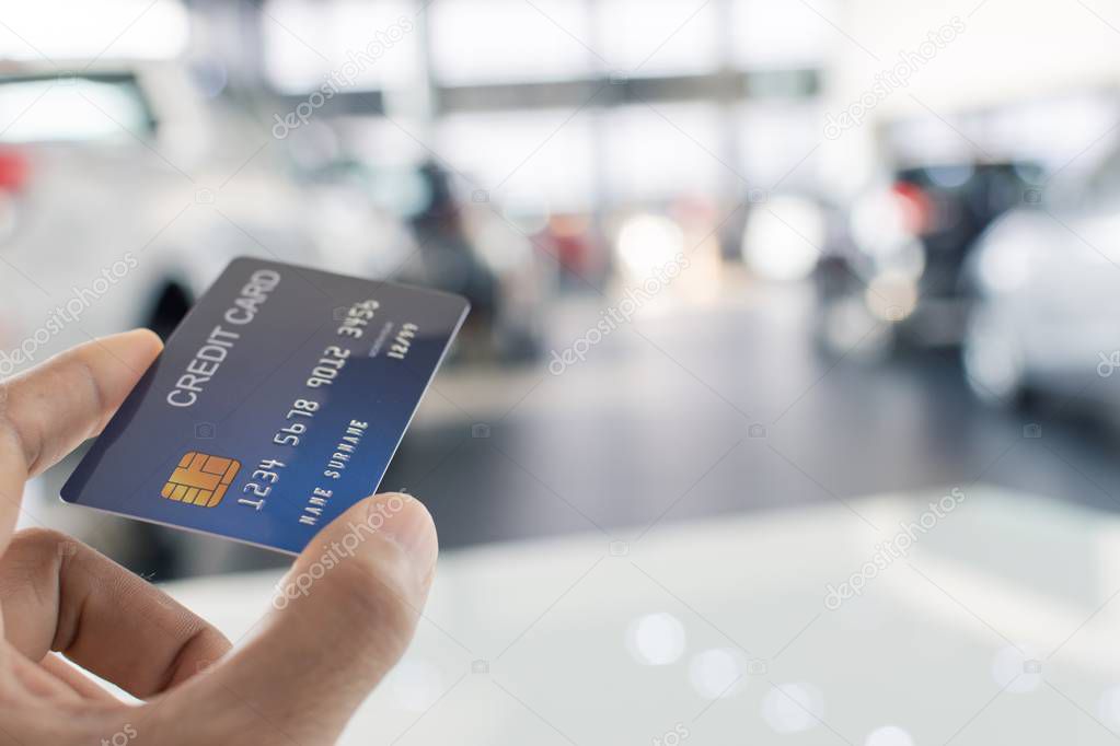 man holding credit card for blurred bokeh background e-shopping 