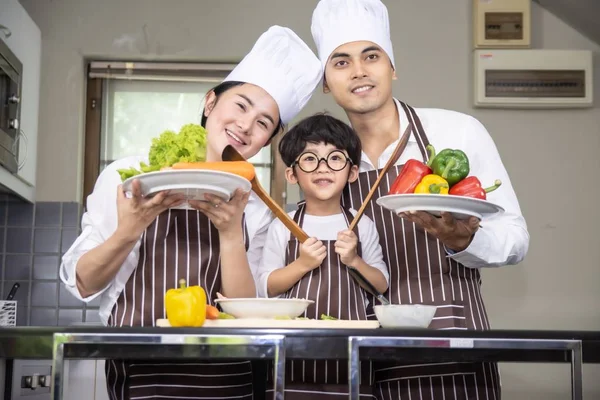 Asian woman young mother and father with son boy cooking salad — Stock Photo, Image