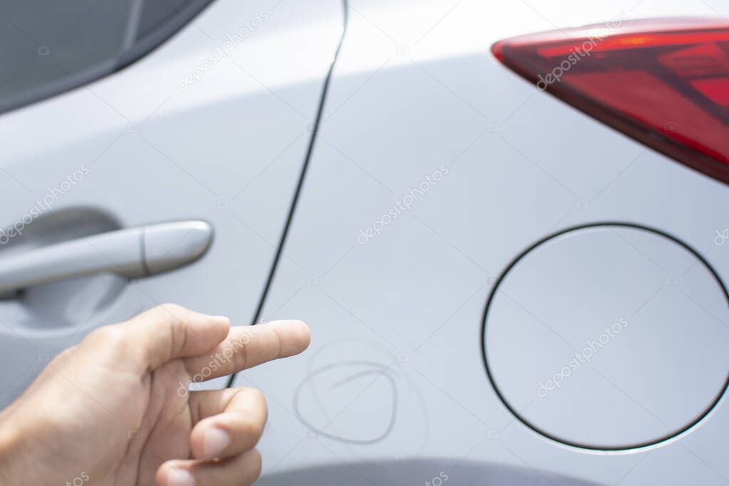 Man inspection Pointing finger trace marking point with car Fuel