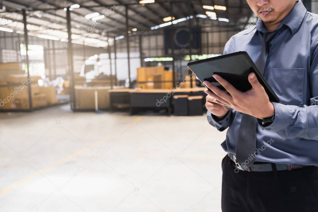 Asian business man writing clipboard on blurred background.metaphor to business in development, success, entrepreneur or employment and advertising logistic image