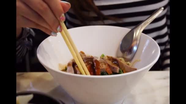 Woman Use Chopsticks Eating Roasted Duck Noodles — Stock Video