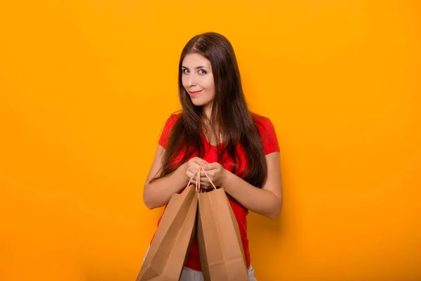Portrait Cheerful Happy Young Woman Paper Bags Hands Standing Yellow — Stock Photo, Image