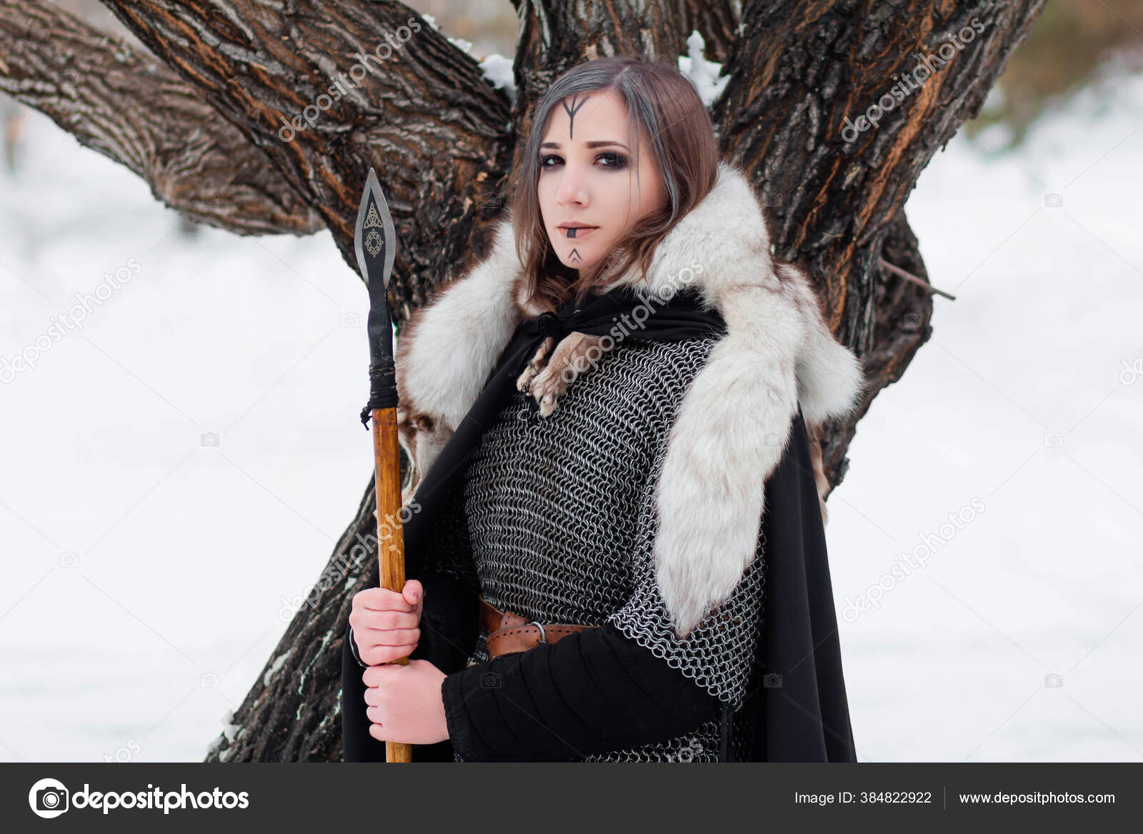 Stunning Viking model dressed in chainmail armor and fur Stock