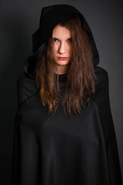 Young Beautiful Woman Black Cloak Hood Studio Gray Background Long — Stock Photo, Image