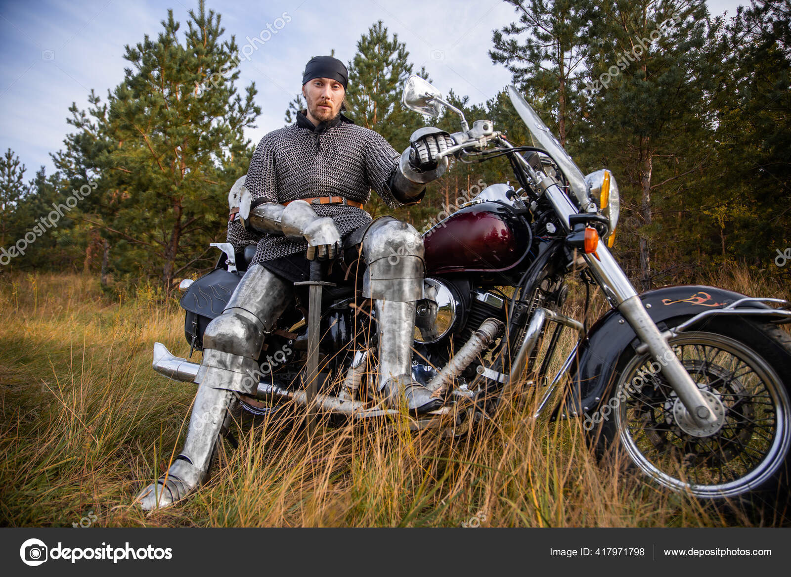 Medieval Warrior Armor Sits Motorcycle Sword His Hands Background