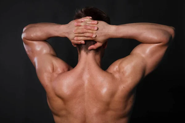 Muscular Fisiculturista Homem Posando Fundo Preto Vista Trás — Fotografia de Stock
