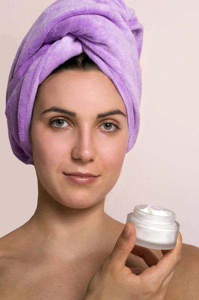 Photo Young Woman Purple Towel Head Holding Face Cream Pink — Stock Photo, Image