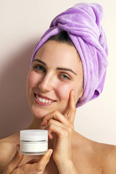 Photo Young Woman Purple Towel Head Holding Face Cream Pink — Stock Photo, Image