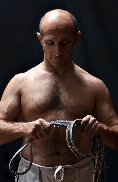 Karate Shotokan Master Holding His Black Belt — Stock Photo, Image