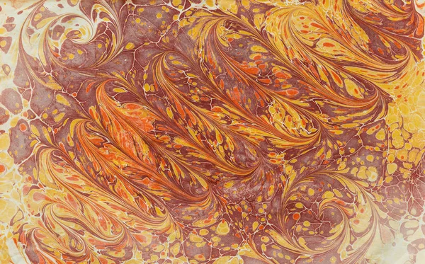 Imprint ebru texture on paper yellow waves — Stock Photo, Image