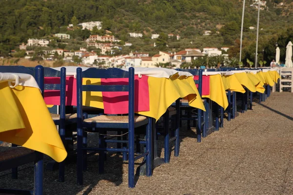 Restaurant in the open air by the sea, evening. Mediterranean Sea, South of Europe, Greece, Skopelos Island.
