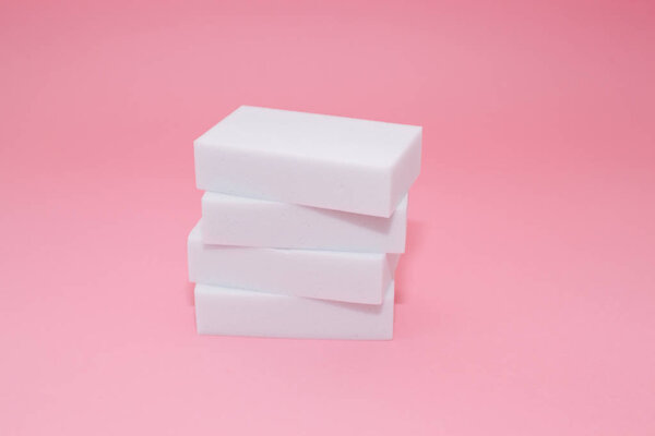 Melamine sponge stack on pink background