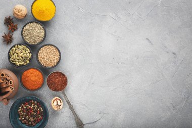 Wooden table of colorful spices. Top view.	