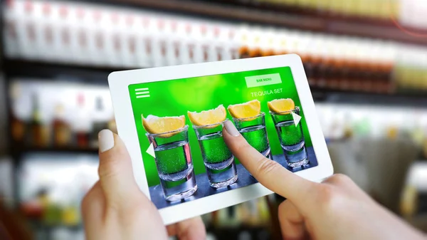 Customer use AR application to order drink at the bar, Hand touching interface