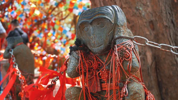 Hear no evil monkey statue in China