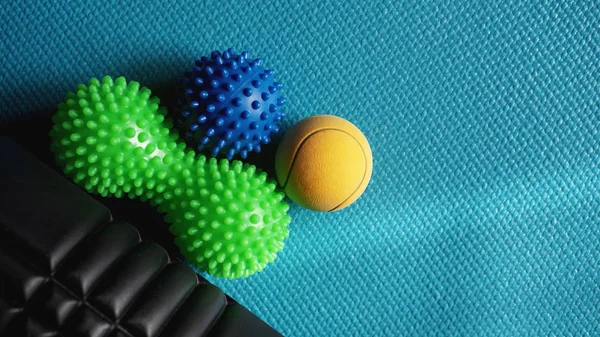 Massage ball roller for self massage, reflexology and myofascial release on blue — Stock Photo, Image