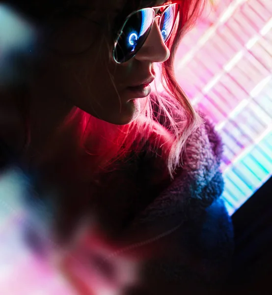Beautiful Young Girl. Attractive Girl with Glasses by Neon Lights