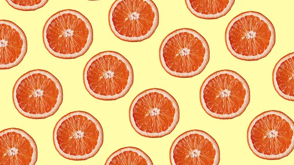 Grapefruit pattern on yellow background. Minimal flat lay concept. — Stock Photo, Image