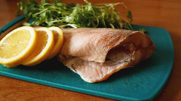 Fresh fish, raw cod fillets with addition of herbs and lemon — Stock Photo, Image