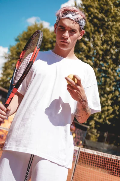 Tennis Sport. Man Playing Tennis Outdoors. Portrait Of Attractive Young Man