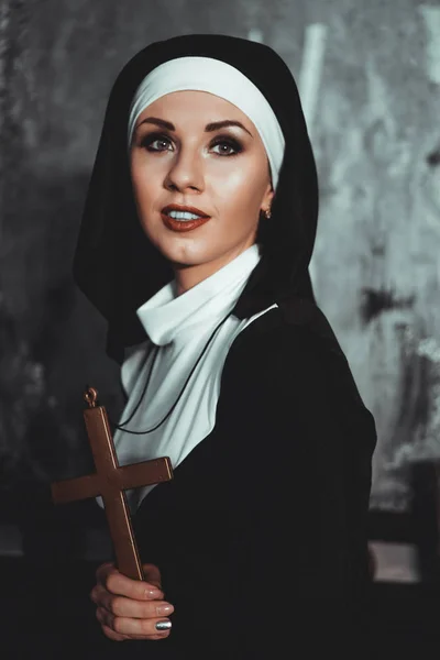 Sexy nun prays indoor. Beautiful young holy sister.