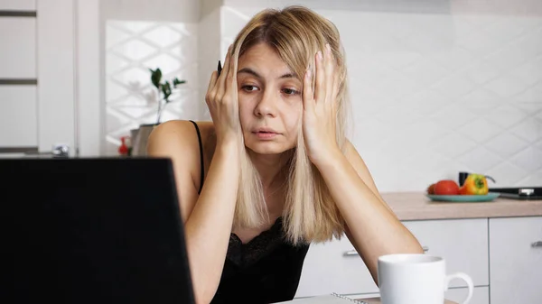 A businesswoman works at home or homeschooling a student using her laptop