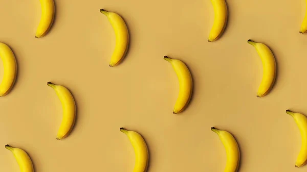 Achtergrond van bananen op een rij op een gouden achtergrond — Stockfoto